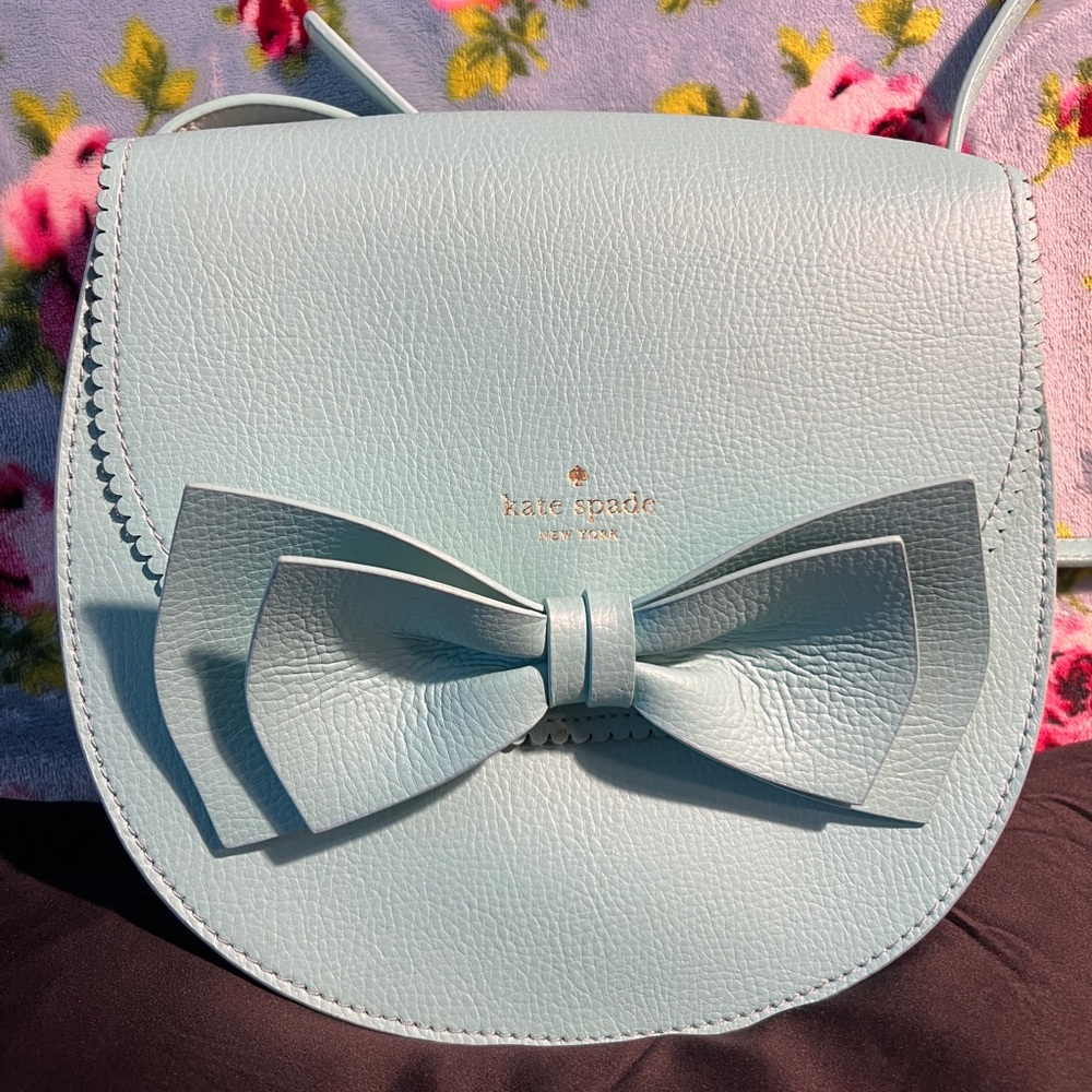 Aqua blue Kate Spade crossbody purse with bow detail
